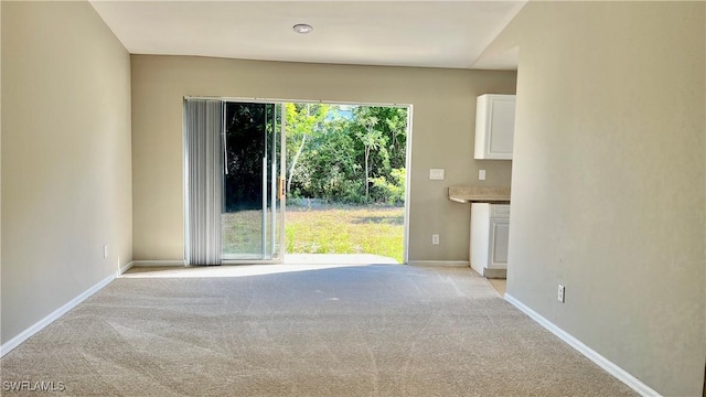4532/4534 29th St SW, Lehigh Acres, FL 33973 - empty room with light colored carpet and baseboards