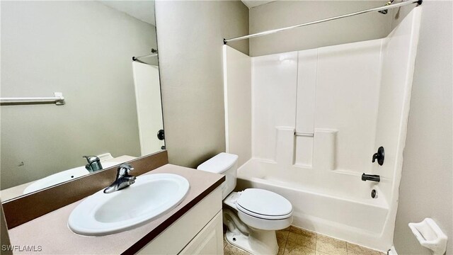 4532/4534 29th St SW, Lehigh Acres, FL 33973 - bathroom with toilet, vanity, washtub / shower combination, and tile patterned flooring
