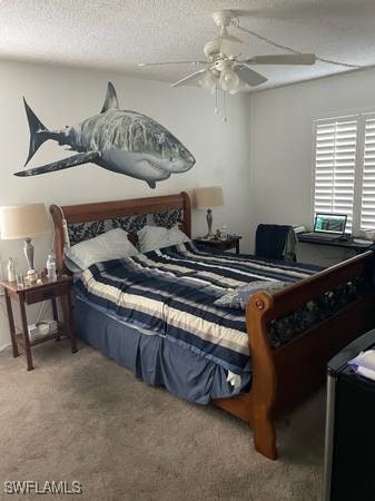 9610 Green Cypress Ln Unit 4, Fort Myers, FL 33905 - carpeted bedroom featuring ceiling fan and a textured ceiling