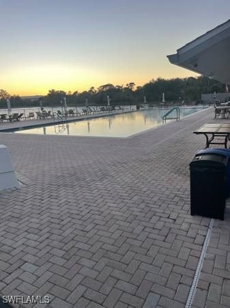 9610 Green Cypress Ln Unit 4, Fort Myers, FL 33905 - view of pool at dusk