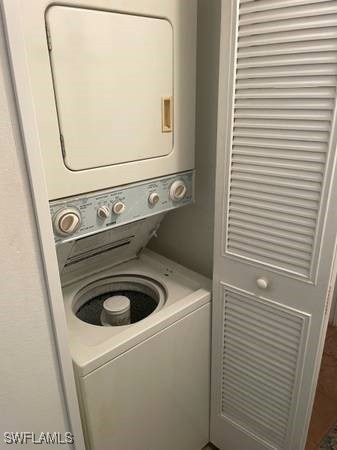 9610 Green Cypress Ln Unit 4, Fort Myers, FL 33905 - laundry area with stacked washer / drying machine
