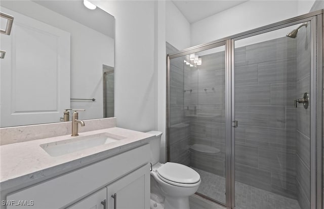 6600 Legacy Way, Ave Maria, FL 34142 - bathroom featuring vanity, toilet, and a stall shower