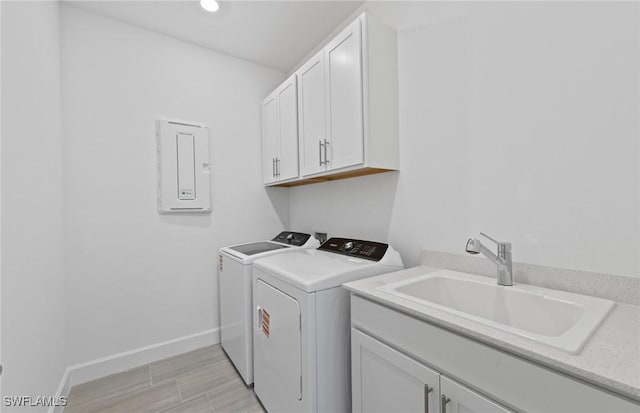 6600 Legacy Way, Ave Maria, FL 34142 - washroom with washing machine and dryer, cabinet space, baseboards, electric panel, and recessed lighting