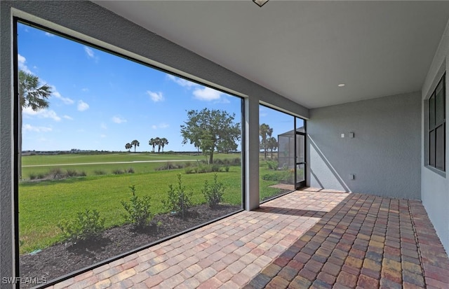 6600 Legacy Way, Ave Maria, FL 34142 - unfurnished sunroom featuring a view of countryside