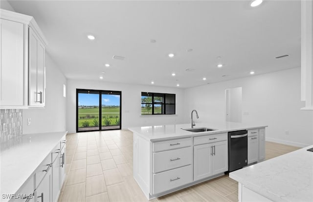 6600 Legacy Way, Ave Maria, FL 34142 - kitchen with a sink, black dishwasher, a center island with sink, recessed lighting, and light countertops