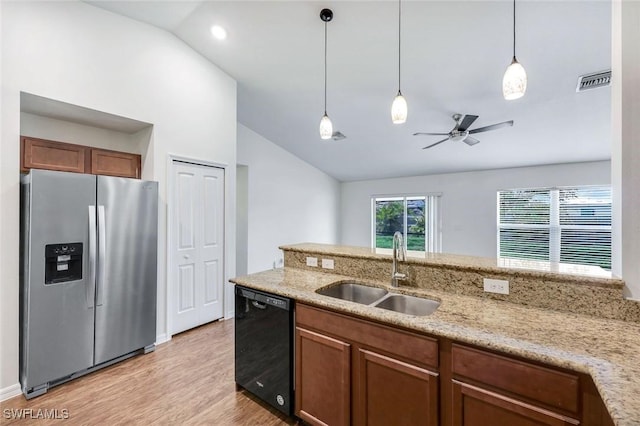 1205 SW 32nd Ter, Cape Coral, FL 33914 - kitchen with stainless steel fridge, dishwasher, a sink, lofted ceiling, and light wood-type flooring