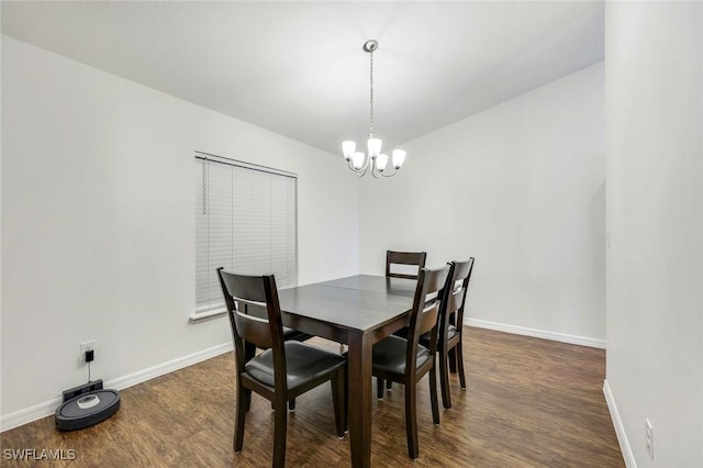 1205 SW 32nd Ter, Cape Coral, FL 33914 - dining area featuring a chandelier, dark wood finished floors, and baseboards