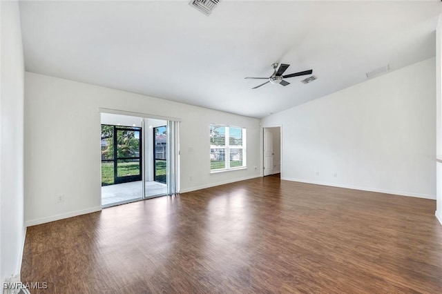 1205 SW 32nd Ter, Cape Coral, FL 33914 - spare room with healthy amount of natural light, a ceiling fan, wood finished floors, and vaulted ceiling