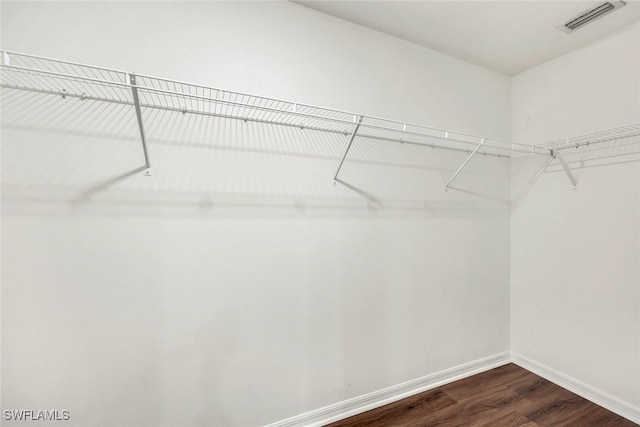 1205 SW 32nd Ter, Cape Coral, FL 33914 - spacious closet featuring dark wood-type flooring