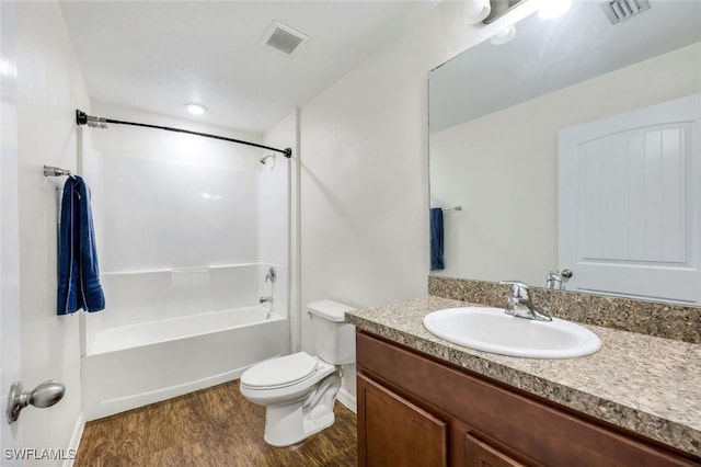1205 SW 32nd Ter, Cape Coral, FL 33914 - full bathroom with wood finished floors, vanity, shower / tub combination, toilet, and baseboards