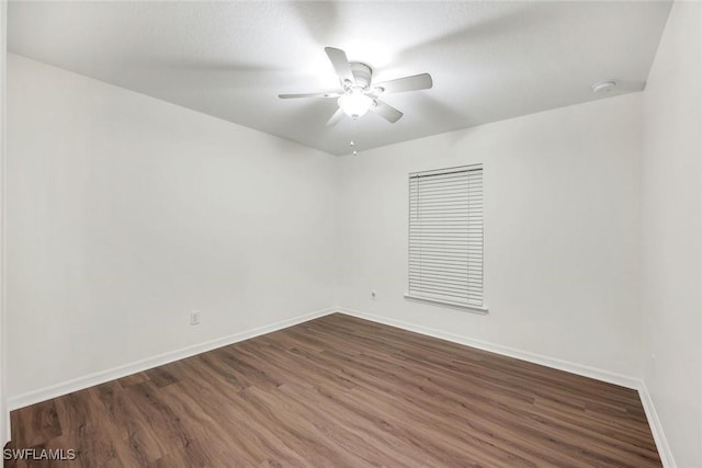 1205 SW 32nd Ter, Cape Coral, FL 33914 - empty room with baseboards, dark wood-type flooring, and ceiling fan