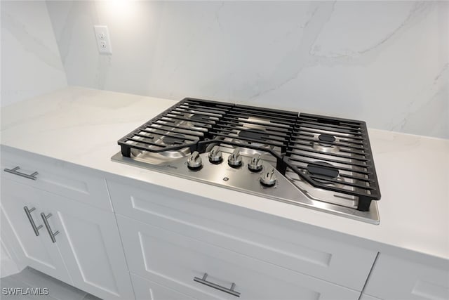 17236 Blue Sapphire Dr, Fort Myers, FL 33913 - detailed view of stainless steel gas stovetop, light countertops, and white cabinets