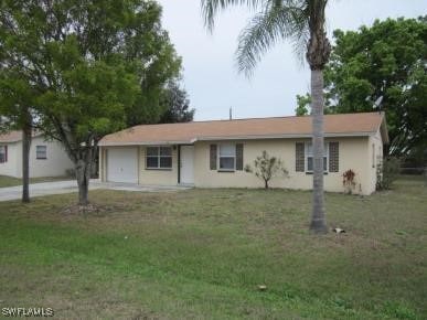 13450 Fourth St, Fort Myers, FL 33905 - single story home featuring a garage, a front yard, and driveway