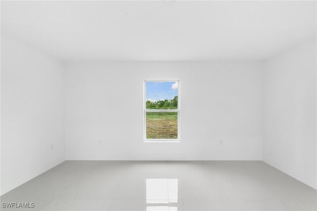 955 Plantation Rd, Lehigh Acres, FL 33974 - empty room featuring baseboards