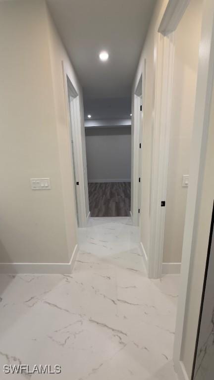 4619 7th St W, Lehigh Acres, FL 33971 - hall featuring baseboards, marble finish floors, and recessed lighting