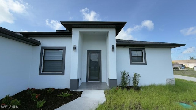 4619 7th St W, Lehigh Acres, FL 33971 - view of exterior entry with stucco siding