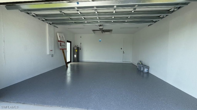 4619 7th St W, Lehigh Acres, FL 33971 - garage featuring electric water heater and a garage door opener