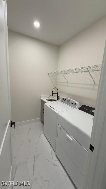 4619 7th St W, Lehigh Acres, FL 33971 - washroom featuring cabinet space, washer and dryer, light marble finish floors, recessed lighting, and baseboards