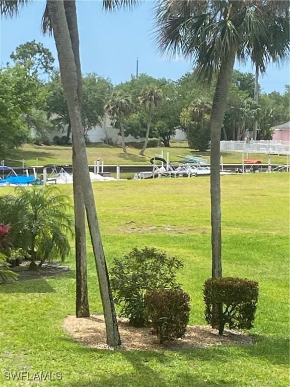 1515 Tropic Ter Unit 1515, North Fort Myers, FL 33903 - view of home's community with a lawn
