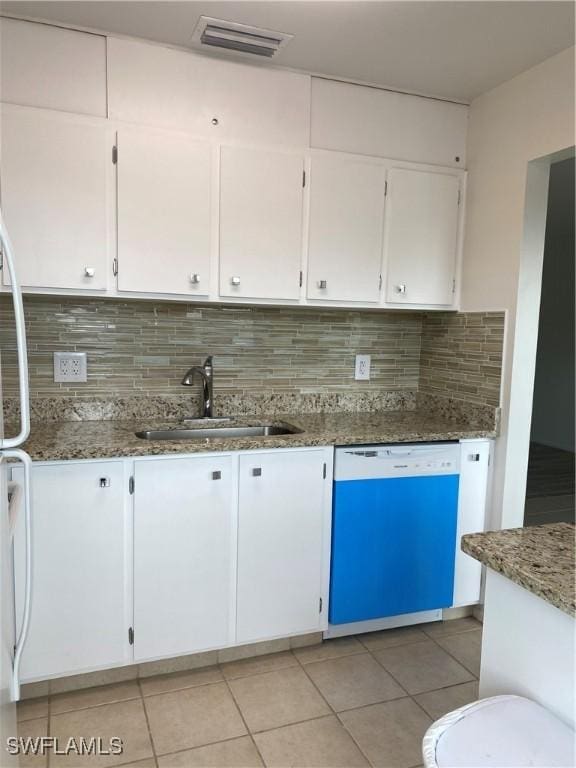 1515 Tropic Ter Unit 1515, North Fort Myers, FL 33903 - kitchen with dishwashing machine, a sink, stone counters, and tasteful backsplash