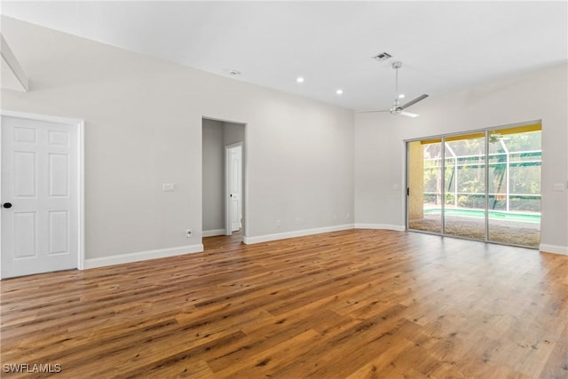 3519 Heron Cove Ct, Bonita Springs, FL 34134 - unfurnished room with wood finished floors, a ceiling fan, baseboards, and recessed lighting