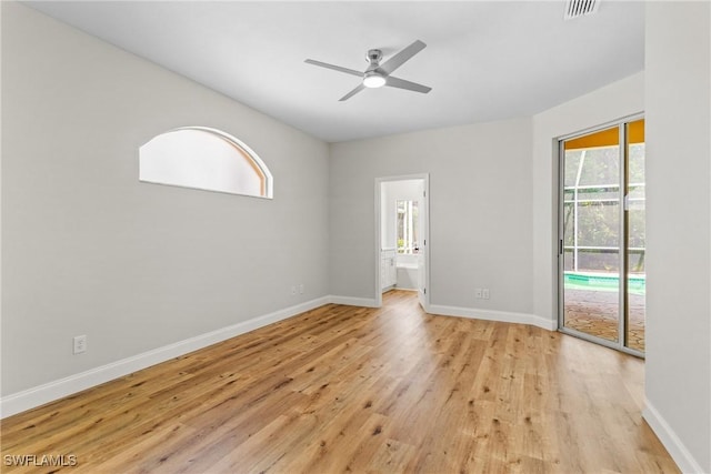 3519 Heron Cove Ct, Bonita Springs, FL 34134 - empty room featuring a ceiling fan, light wood-style floors, and baseboards
