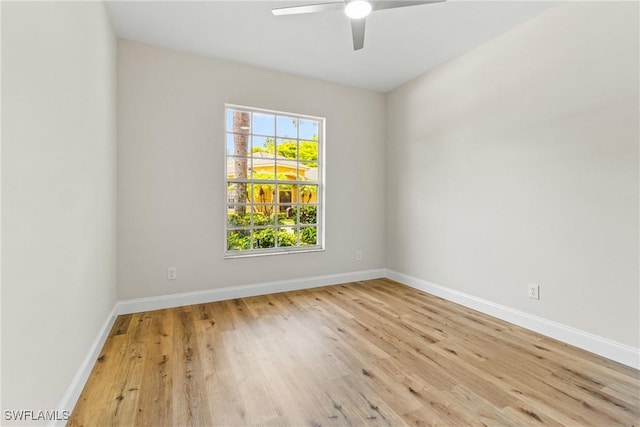 3519 Heron Cove Ct, Bonita Springs, FL 34134 - spare room with wood finished floors, baseboards, and a ceiling fan