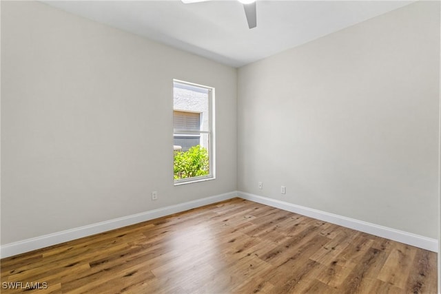 3519 Heron Cove Ct, Bonita Springs, FL 34134 - empty room featuring a ceiling fan, light wood-type flooring, and baseboards
