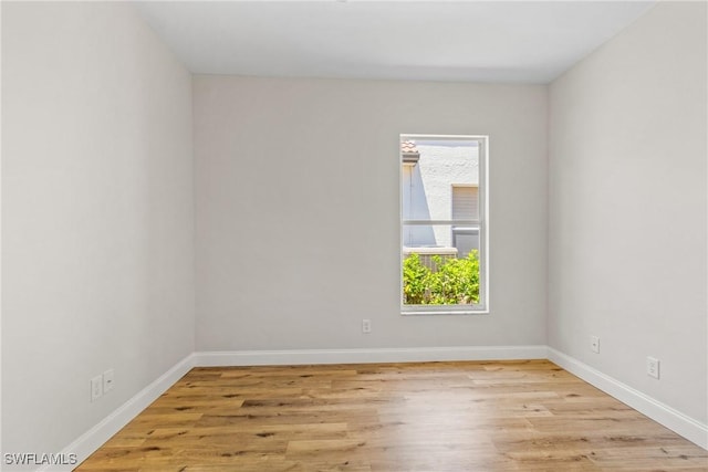 3519 Heron Cove Ct, Bonita Springs, FL 34134 - unfurnished room with light wood-type flooring and baseboards