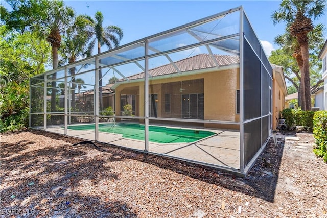 3519 Heron Cove Ct, Bonita Springs, FL 34134 - rear view of house featuring a patio, a tiled roof, a lanai, and an outdoor pool