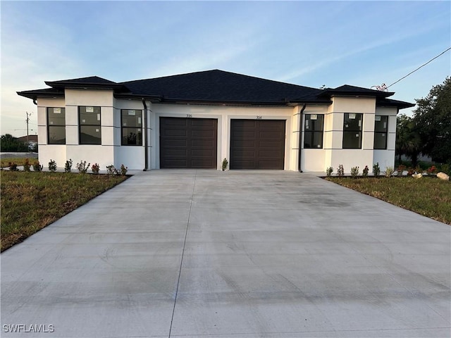 314/316 Poplar St, Lehigh Acres, FL 33974 - view of front of house featuring stucco siding, an attached garage, driveway, and a front lawn