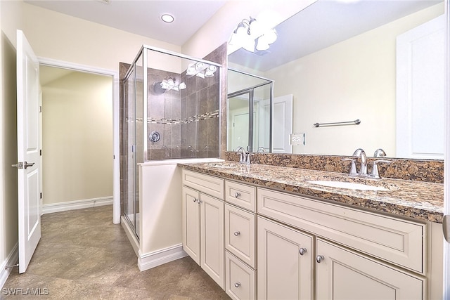 9440 Sardinia Way Unit 110, Fort Myers, FL 33908 - full bathroom featuring double vanity, a stall shower, and baseboards