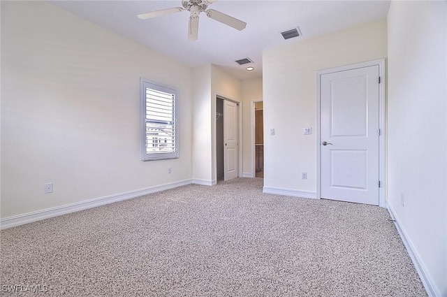 9440 Sardinia Way Unit 110, Fort Myers, FL 33908 - unfurnished bedroom featuring light carpet, baseboards, and a ceiling fan