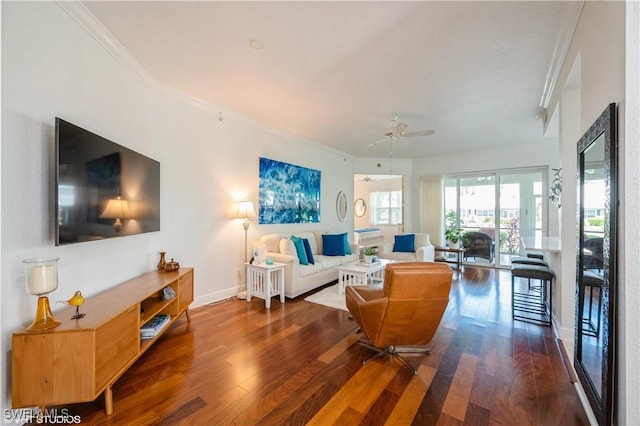 4610 Hawks Nest Dr Unit A104, Naples, FL 34114 - living area with crown molding, wood-type flooring, a ceiling fan, and baseboards