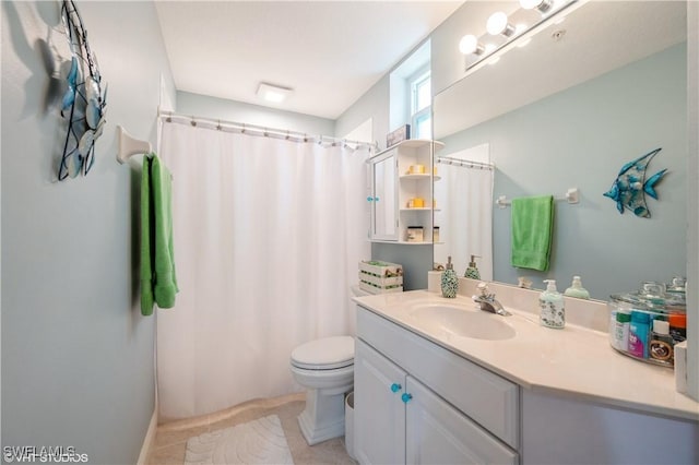 4610 Hawks Nest Dr Unit A104, Naples, FL 34114 - full bath with vanity, toilet, a shower with shower curtain, and tile patterned flooring
