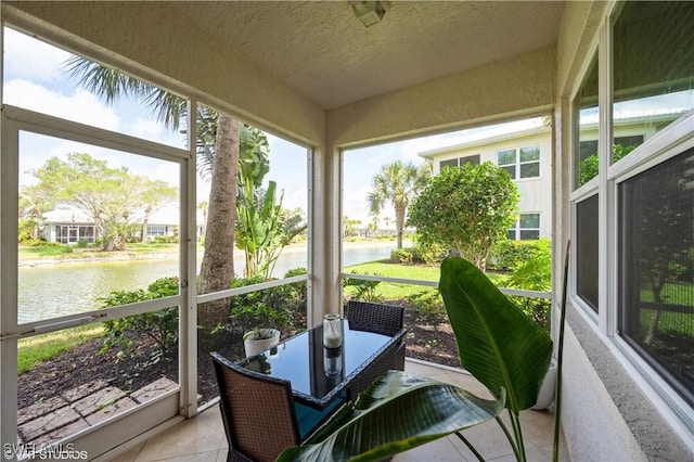 4610 Hawks Nest Dr Unit A104, Naples, FL 34114 - sunroom / solarium featuring a water view