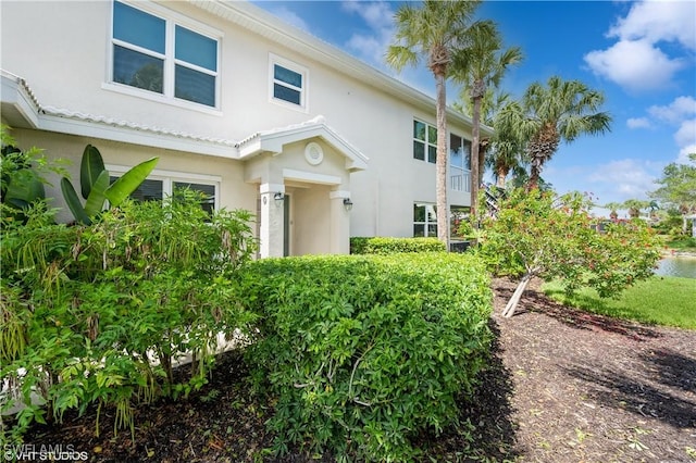 4610 Hawks Nest Dr Unit A104, Naples, FL 34114 - view of front facade featuring stucco siding