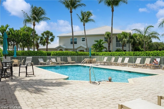 4610 Hawks Nest Dr Unit A104, Naples, FL 34114 - community pool with a patio area