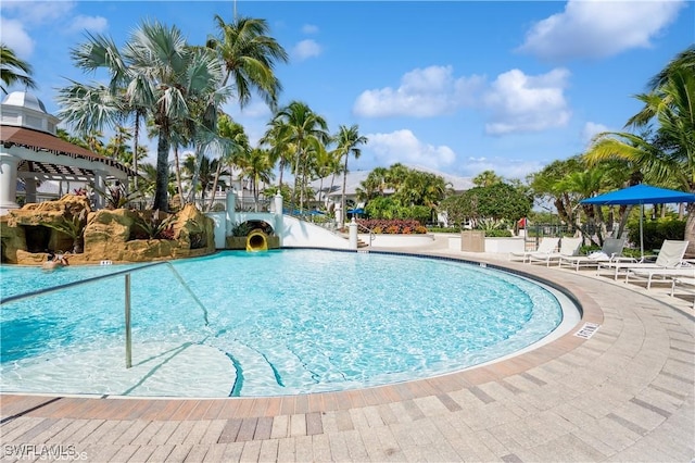 4610 Hawks Nest Dr Unit A104, Naples, FL 34114 - community pool with a patio