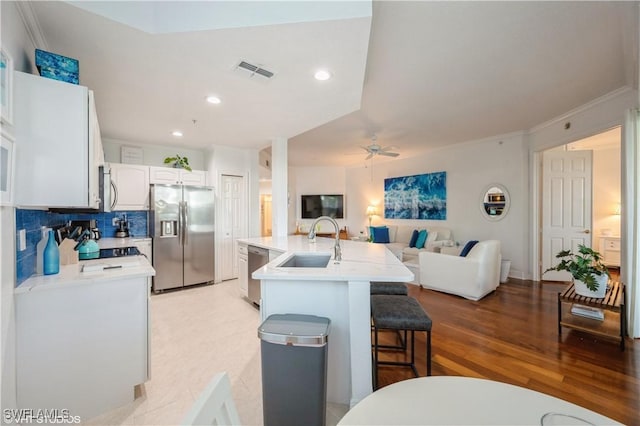4610 Hawks Nest Dr Unit A104, Naples, FL 34114 - kitchen with appliances with stainless steel finishes, a sink, a ceiling fan, light countertops, and recessed lighting