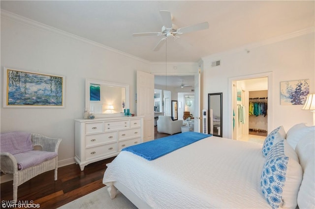 4610 Hawks Nest Dr Unit A104, Naples, FL 34114 - bedroom featuring wood finished floors, ornamental molding, a spacious closet, baseboards, and ceiling fan