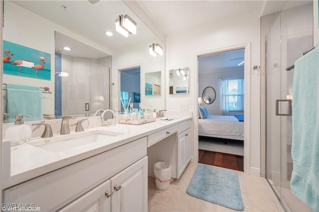 4610 Hawks Nest Dr Unit A104, Naples, FL 34114 - full bath featuring double vanity, a stall shower, ensuite bathroom, and tile patterned flooring
