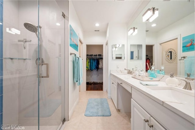 4610 Hawks Nest Dr Unit A104, Naples, FL 34114 - full bath featuring a walk in closet, a shower stall, tile patterned floors, double vanity, and recessed lighting