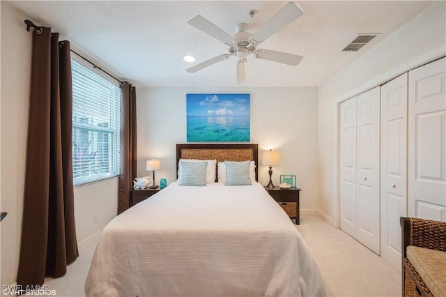 4610 Hawks Nest Dr Unit A104, Naples, FL 34114 - bedroom with a closet, light colored carpet, ceiling fan, and baseboards
