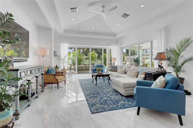 1262 10th St N, Naples, FL 34102 - living area with a raised ceiling, a ceiling fan, and marble tiled floors