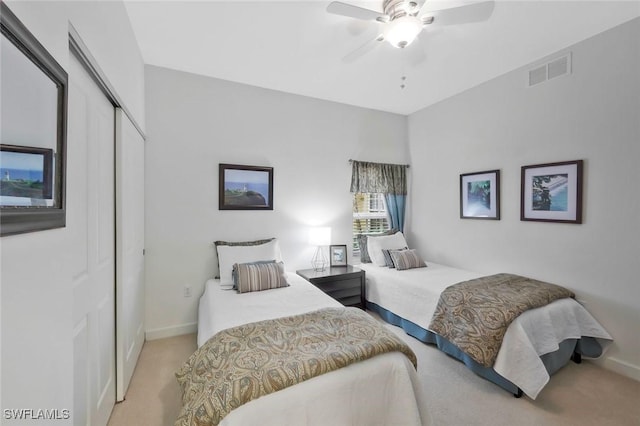 8565 Via Garibaldi Cir Unit 104, Estero, FL 33928 - bedroom with carpet floors, a closet, baseboards, and ceiling fan