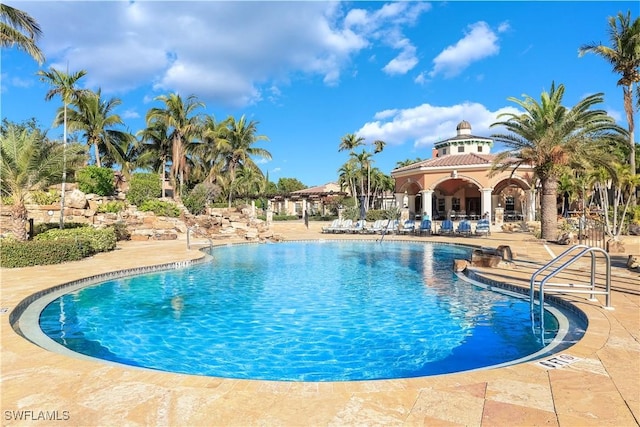 8565 Via Garibaldi Cir Unit 104, Estero, FL 33928 - community pool featuring a patio area