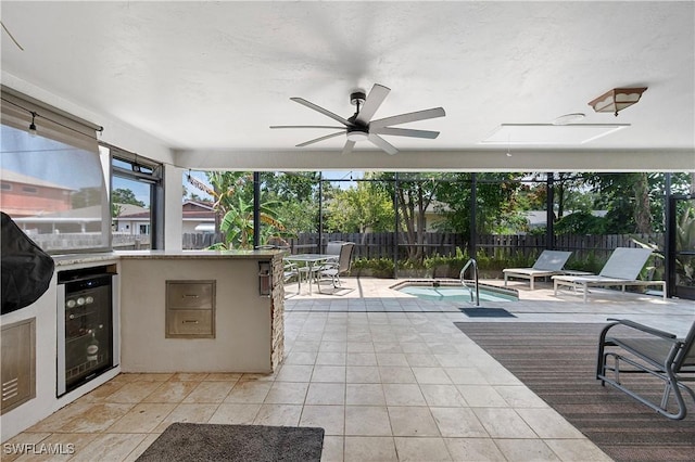 663 110th Ave N, Naples, FL 34108 - view of patio featuring beverage cooler, ceiling fan, and area for grilling
