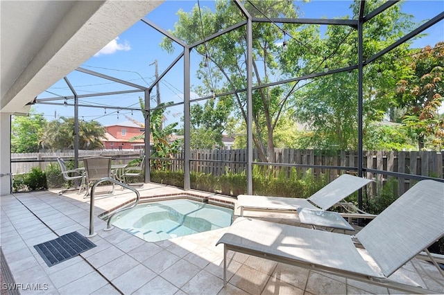 663 110th Ave N, Naples, FL 34108 - view of swimming pool featuring an in-ground hot tub, a fenced backyard, and a patio area