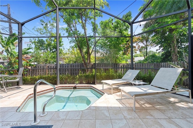 663 110th Ave N, Naples, FL 34108 - view of swimming pool with a patio area, a fenced backyard, a swimming pool, and glass enclosure